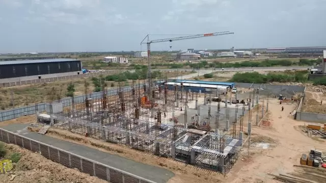 Structure rising, tower crane in action